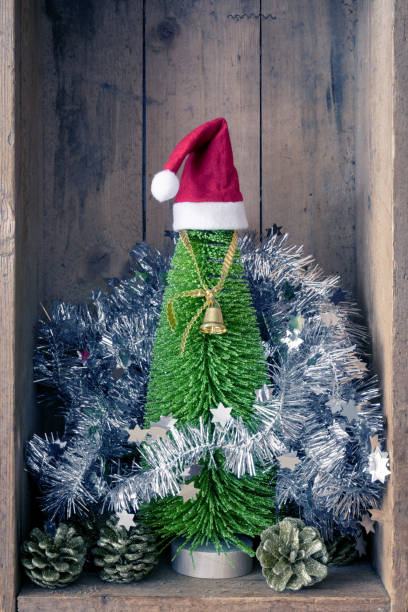 christmas decoration golden bell jar and tree in a wooden box background - christmas decoration campanula decoration christmas imagens e fotografias de stock