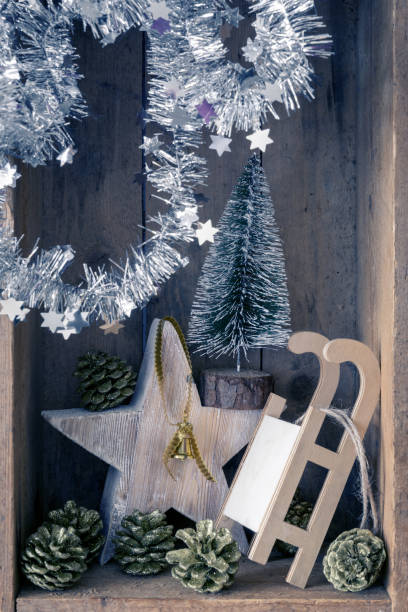 christmas decoration golden bell jar, sledge, star and tree in a wooden box background - christmas decoration campanula decoration christmas imagens e fotografias de stock