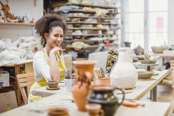 istock Young Woman Creating Pottery 1072985310