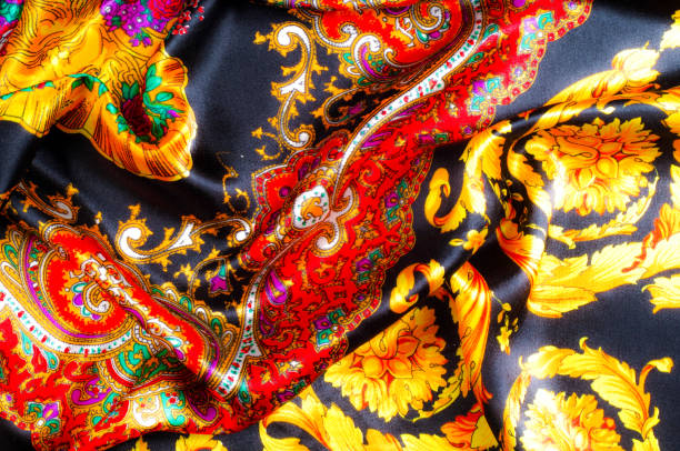 istock Background texture, drawing. Silk fabric. Fabric with bright patterns of yellow and red colors, Indian fabric, silk fabric around the yard, printed silk, printed fabric Sanganery 1072985542