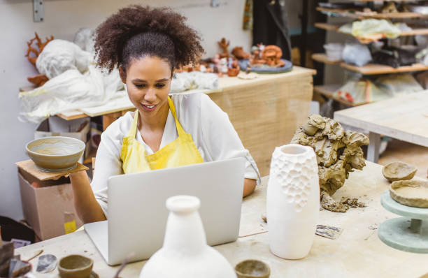 istock Young Woman Creating Pottery 1072985546