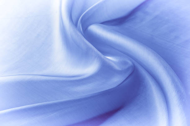 istock Background texture, pattern. Blue silk fabric. Smooth elegant blue silk or satin can use as background. Luxurious Christmas background or New Year background design 1072985606
