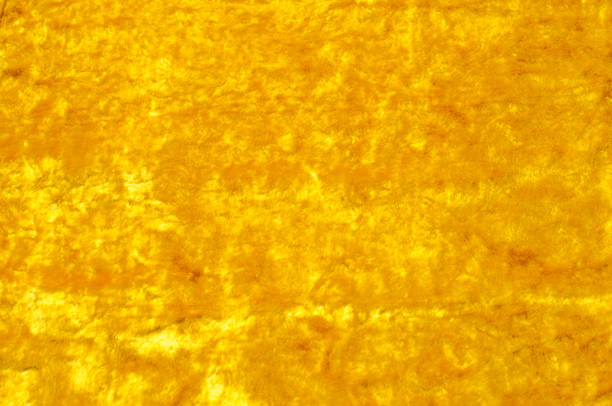 istock Texture, background, pattern. Cloth velvet yellow. This gorgeous stretch velour fabric has a velvety pile.The panne nap adds shimmer and texture! 1072985608