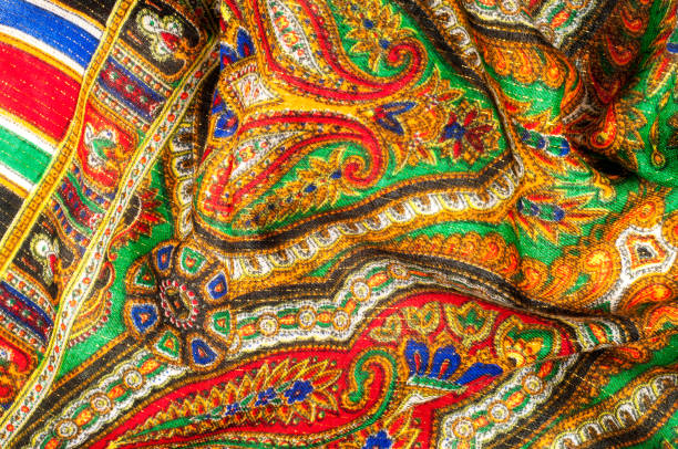 istock Texture, background, pattern. Woman's headscarf, shawl. Bright colors. Paisley. Indian themes. Fabric for clothes Fabric 100% silk. One Fashion Soft Women's Shawl Red Georgette Female Swarf 1072985678