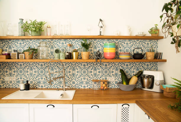 Rustic Southwest USA Kitchen: Mexican tile backsplash, hanging pots, stovetop.  Shot in Santa Fe, NM.