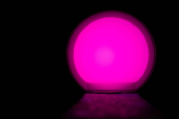 pink glow ball and light the path on an isolated black background