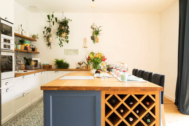 istock Modern and cozy kitchen interior with shelfs, kitchen accessories and plants. Bright and sunny space. 1072987006