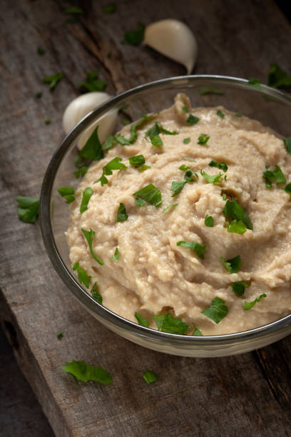 istock Homemade spread made from mashed boiled beans, oil and garlic in bowl 1072987508