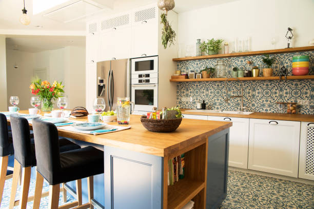 istock Fresh summer breakfast in Mediterranean style kitchen. Bright and sunny space with a lot of herbs and plants. Modern kitchen with open space. 1072989086