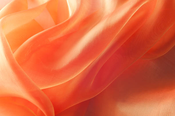 Texture, background, pattern. Orange Silk Fabric for Drapery Abstract Background. Abstract Fabric Flame Background, Artistic Waving Cloth Fractal Pattern