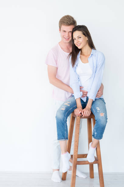 istock man woman smiling hug joyful happy relationship 1072994632