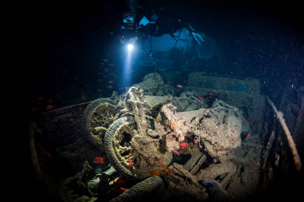 istock Rusted and overgrown motorcycles explored by a scuba diver in an underwater shipwreck SS Thistlegorm in the Red Sea 1072996086