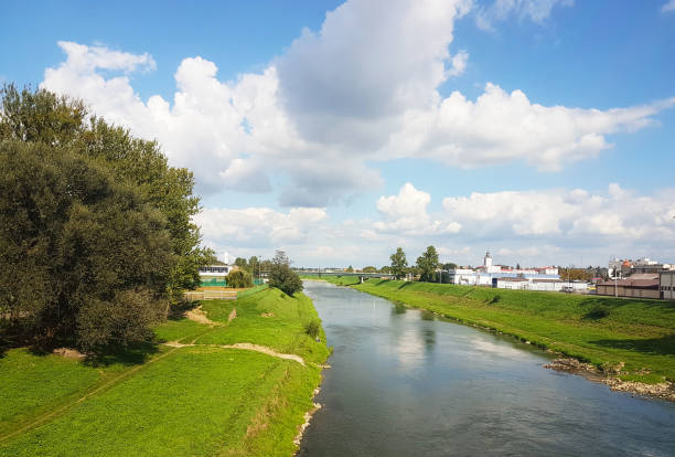 istock city promenade. Wislock river on a summer sunny day. 1073001318