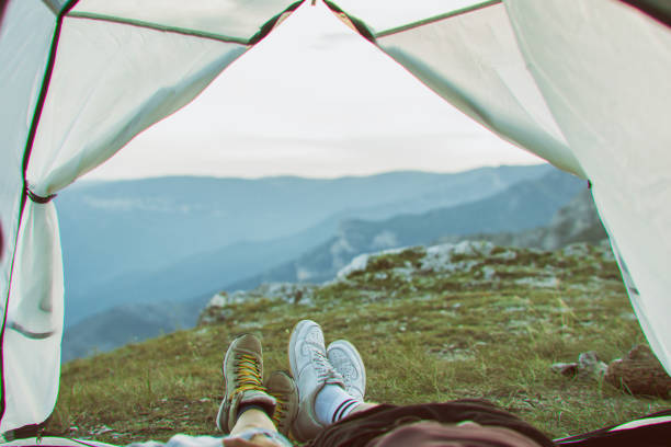 istock Happy Young Couple Camping in Mountain 1073001946