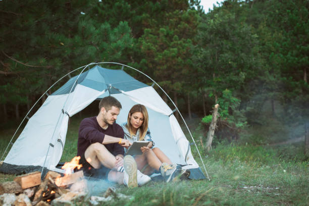 istock Young Couple Searching For Direction on Digital Tablet 1073002268