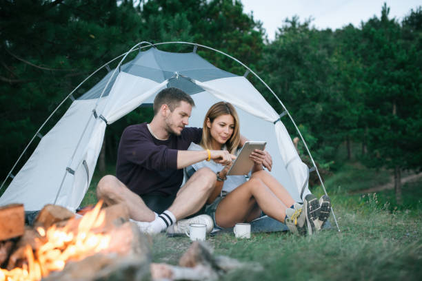 istock Young Couple Searching For Direction on Digital Tablet 1073003858