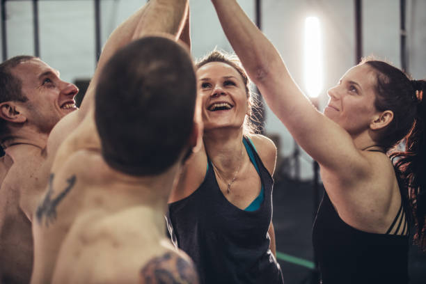 istock Gym friends holding hands in gym 1073005168