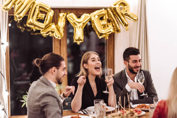 istock friends at dinner at home for the new year 1073007440
