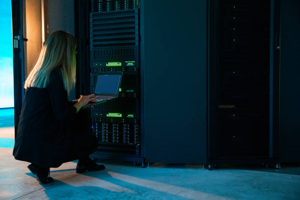 istock Young Female IT Professional Connecting to Supercomputer WIth Laptop 1073008998