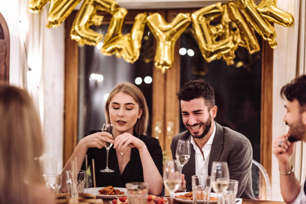 istock friends at dinner at home for the new year 1073009638