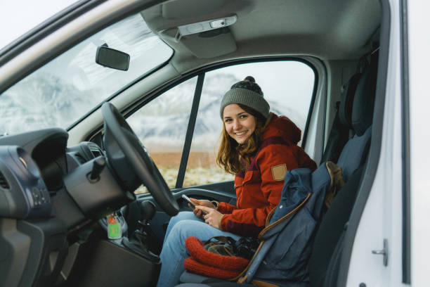 istock Woman sitting on passenger seat in  camper van 1073009920