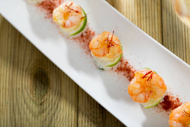 istock Roasted prawns on rice with saffron and lime 1073011424