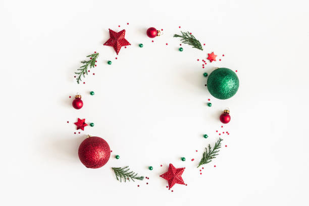 istock Christmas composition. Christmas wreath made of decorations, fir tree branches on white background. Flat lay, top view, copy space 1073016684