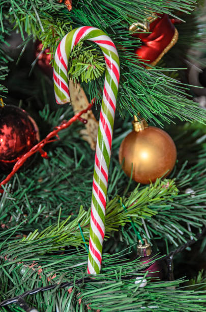 istock Christmas tree hanging ornament, colored lollipop, close up 1073017778