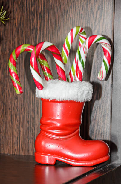 istock Red Santa Claus show with colored sweet lollipops 1073019846