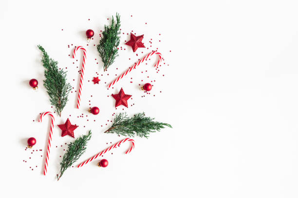 istock Christmas composition. Red decorations, fir tree branches on white background. Christmas, winter, new year concept. Flat lay, top view, copy space 1073020040