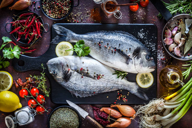 istock Sea bream and ingredients for seasoning and cooking fish 1073023552