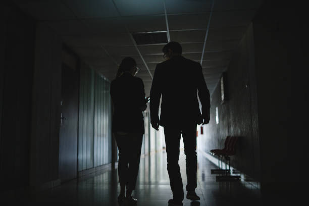 istock Silhouete of detectives walking 1073023854