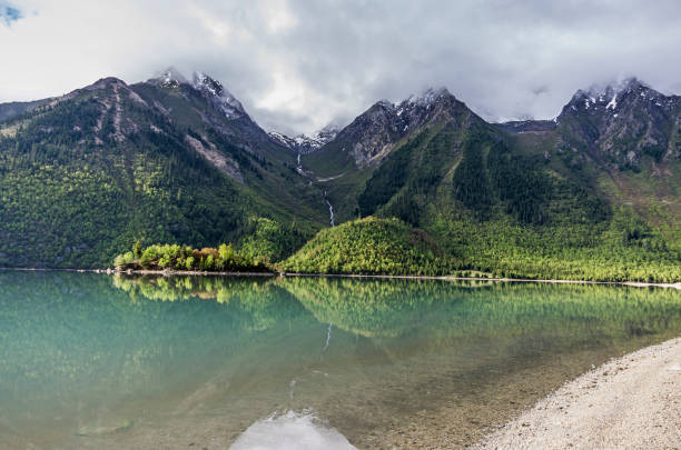 istock Grassland with snow mountain 1073024836