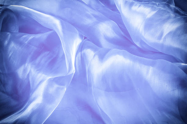 istock Background texture, pattern. Blue silk fabric. Smooth elegant blue silk or satin can use as background. Luxurious Christmas background or New Year background design 1073025494