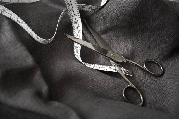 istock designer clothes custom made craftman suit tailor 1073025932