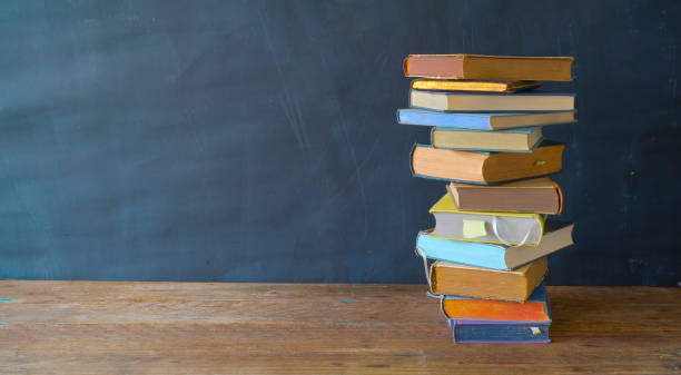 istock stack of books, panorama, good copy space, education,reading,back to school concept 1073028130