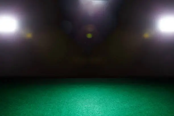 Empty gambling table in green colors. Light effect.