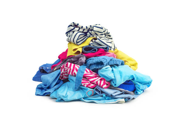 a pile of bright clothes isolated on white background - monte roupa imagens e fotografias de stock