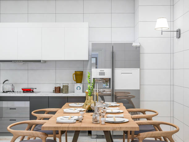 istock Modern apartment kitchen, solid wood dining table and dining chair in a spacious room, solid wood custom rail and refrigerator, various tools neatly placed 1073035100