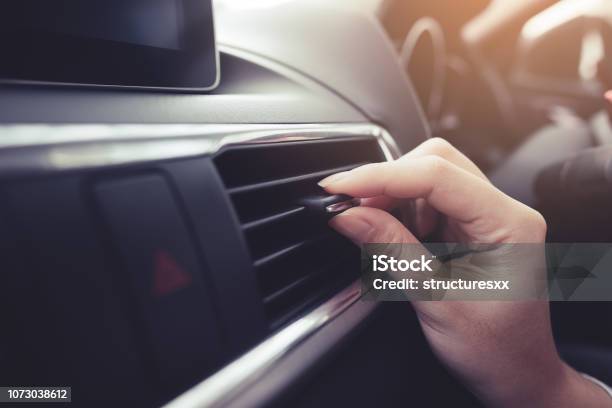 Closeup Female Hand Adjusting Air Ventilation Grille Stock Photo - Download Image Now