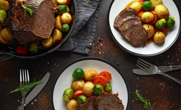 istock Sliced Roast beef with honey glazed vegetables, served on plate. festive dinner 1073038688