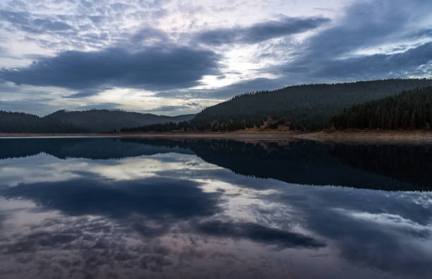 istock Mountain lake early autumn sunrise 1073039452
