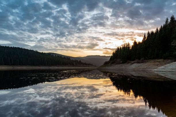 istock Mountain lake early autumn sunrise 1073039678