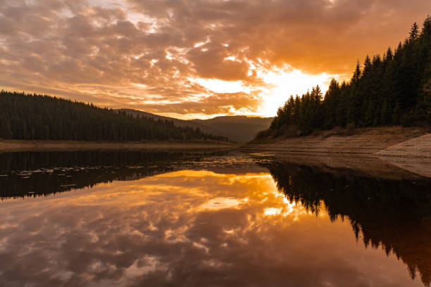 istock Mountain lake early autumn sunrise 1073039776