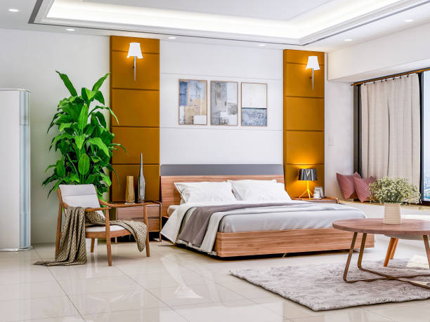 istock Luxurious hotel bedroom, double bed with low carbon and coffee table, next to solid wood chairs and green plants, sunlight shining through the glass window into the room 1073040544