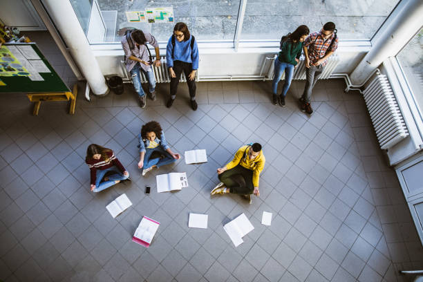 istock Above view of high school students in a hallway. 1073041196