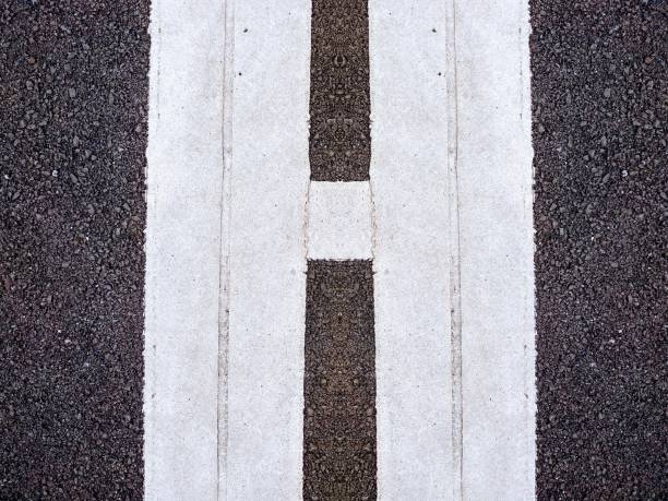 istock Letter H in White in Tarmac 1073041282