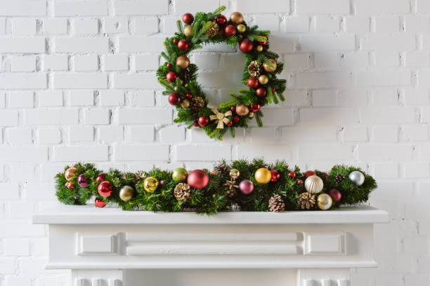 istock festive christmas wreath over fireplace mantel with white brick wall 1073043898