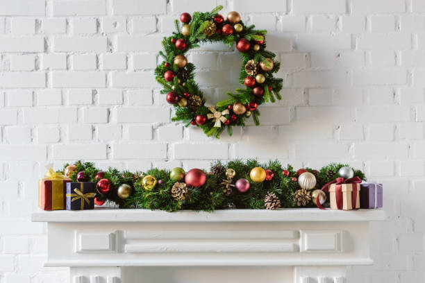 istock christmas wreath and decorations over fireplace mantel with white brick wall 1073043936