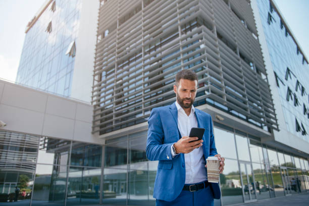 istock Handsome young businessman talking on his phone 1073045648